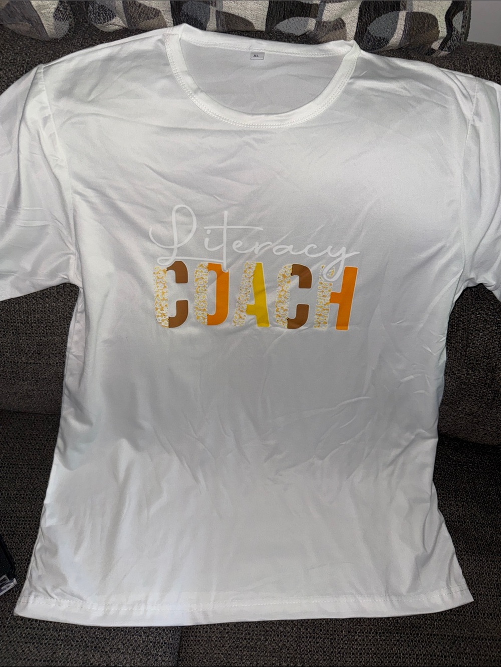 Literacy Coach White T-Shirt with Gold & Orange Lettering
